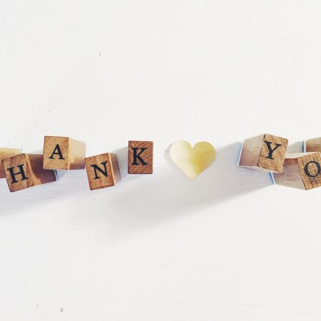 Wooden blocks spell out "Thank you"